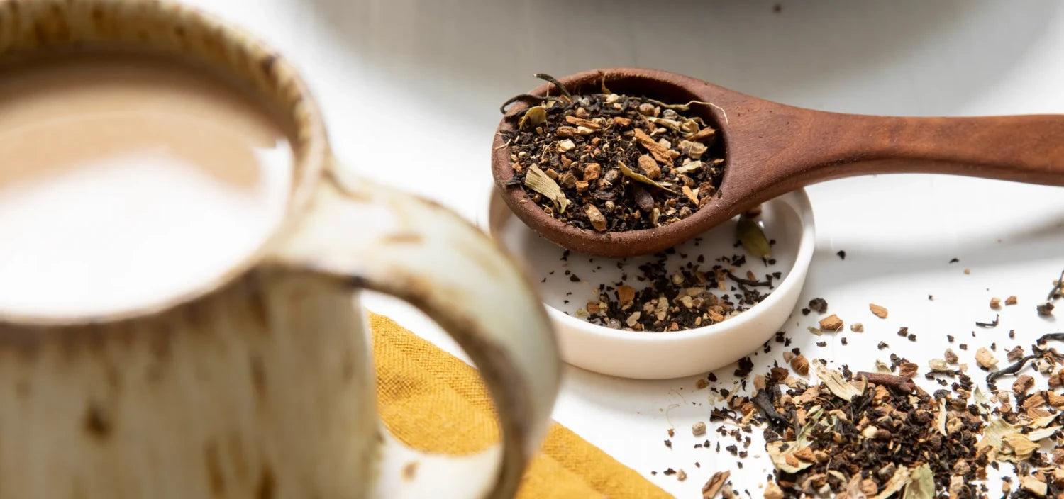A selection of tea and coffee alongside various spices, showcasing ingredients for brewing flavorful beverages.