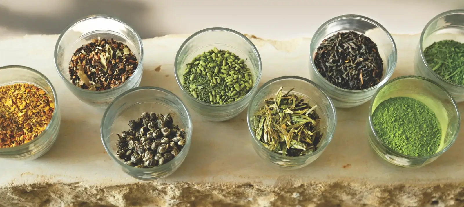 An assortment of herbs and spices ideal for tea making, featuring vibrant colors and distinct shapes.