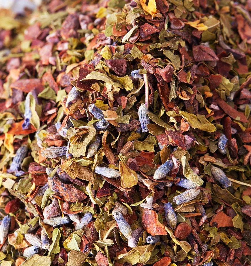 A pile of dried cacao mint herbs and leaves, showcasing their rich texture and earthy colors for herbal infusion.