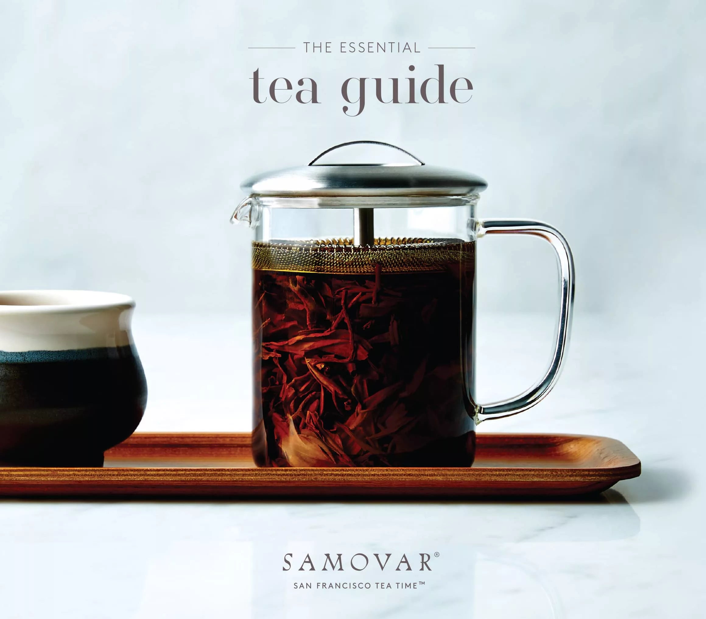A timeless tea guide featuring a decorative samovar, exploring different tea types and brewing techniques.