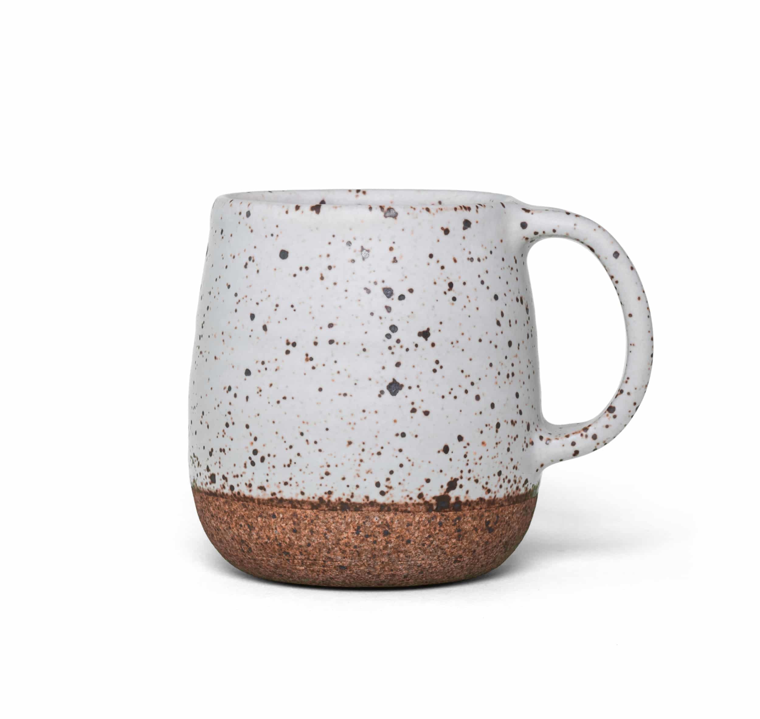 A white ceramic chai mug featuring a speckled design, showcasing a blend of textures and colors.