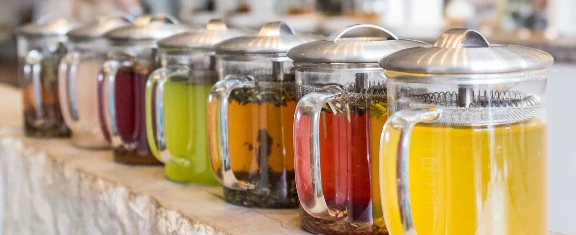 A glass jar filled with brewed tea, showcasing its rich amber color