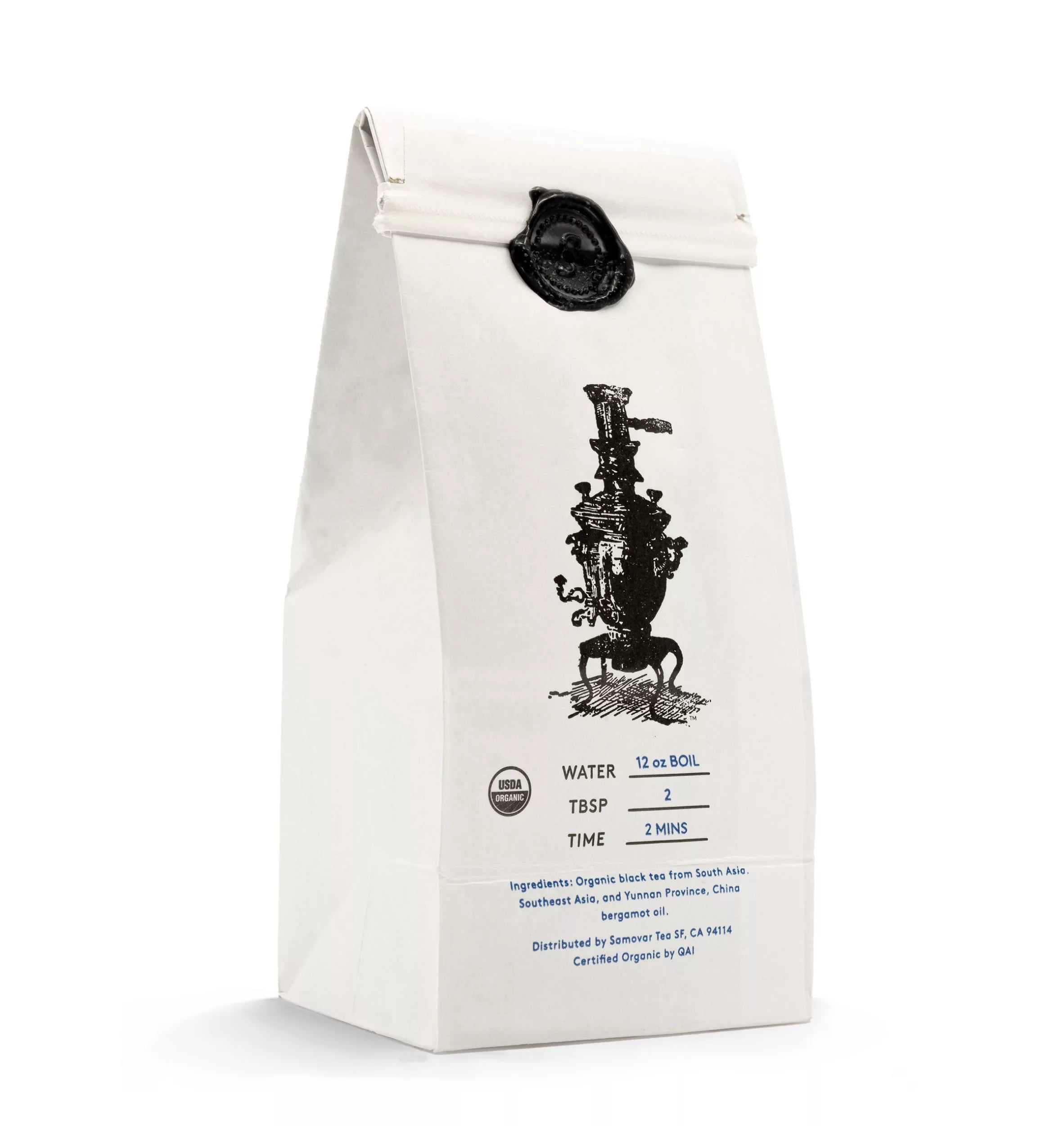 A beautifully packaged Earl Grey tea bag placed on a white surface, showcasing its branding details.